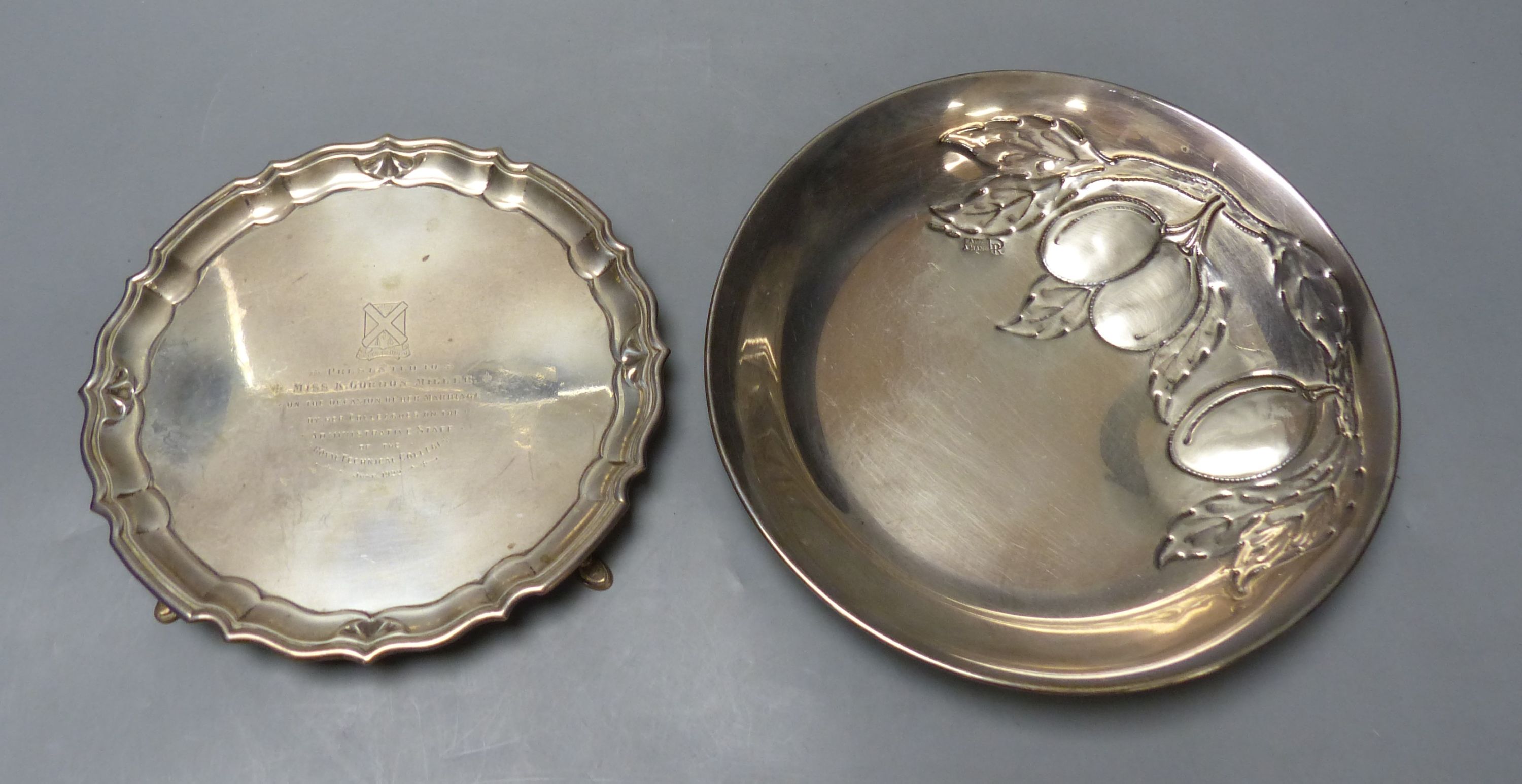 A George V silver waiter, Chester, 1921, 17.9cm and an Italian 800 standard white metal bowl embossed with fruit